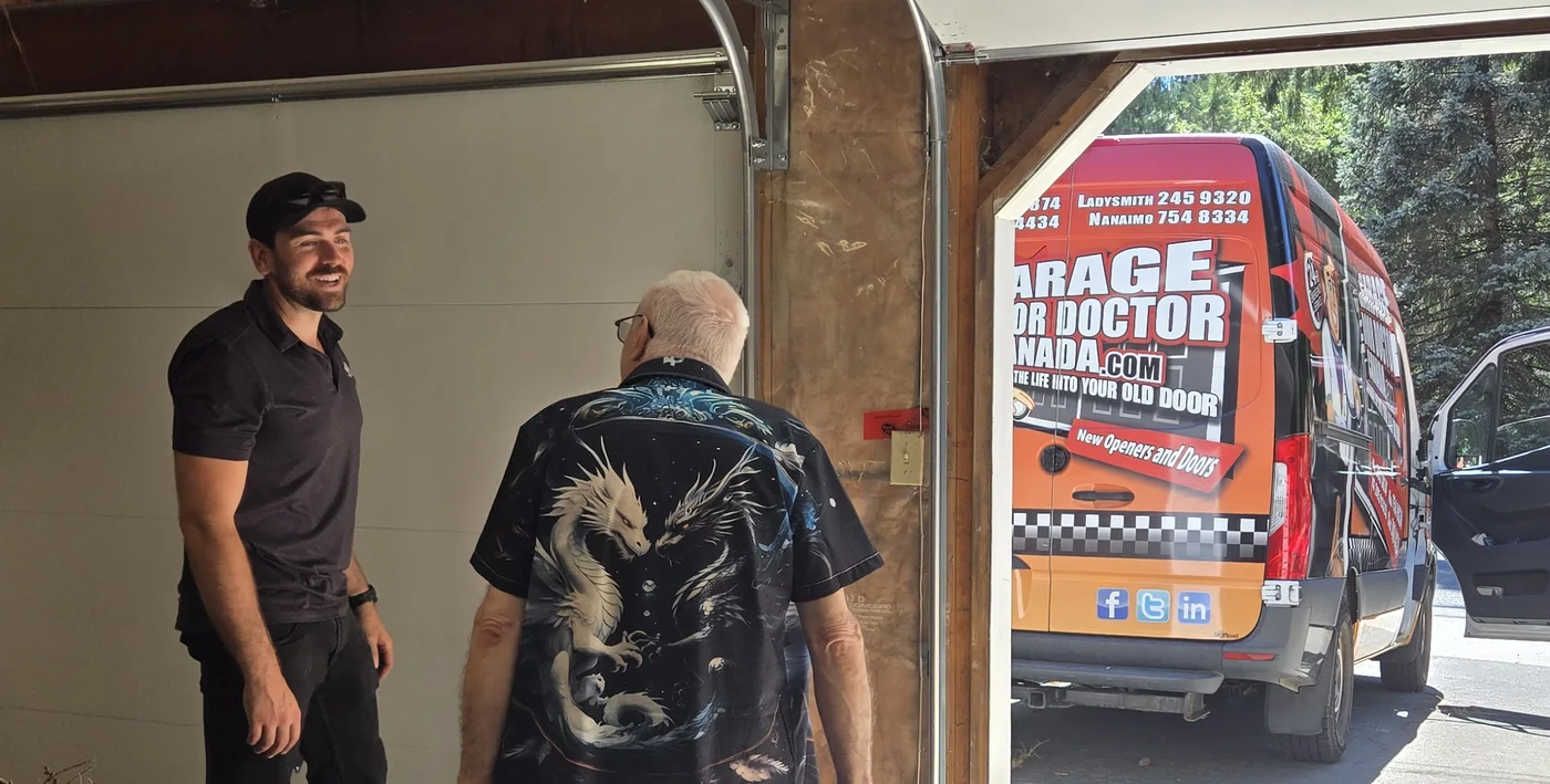 Mark from Garage Door Doctor Canada talking with a customer, branded van in the driveway