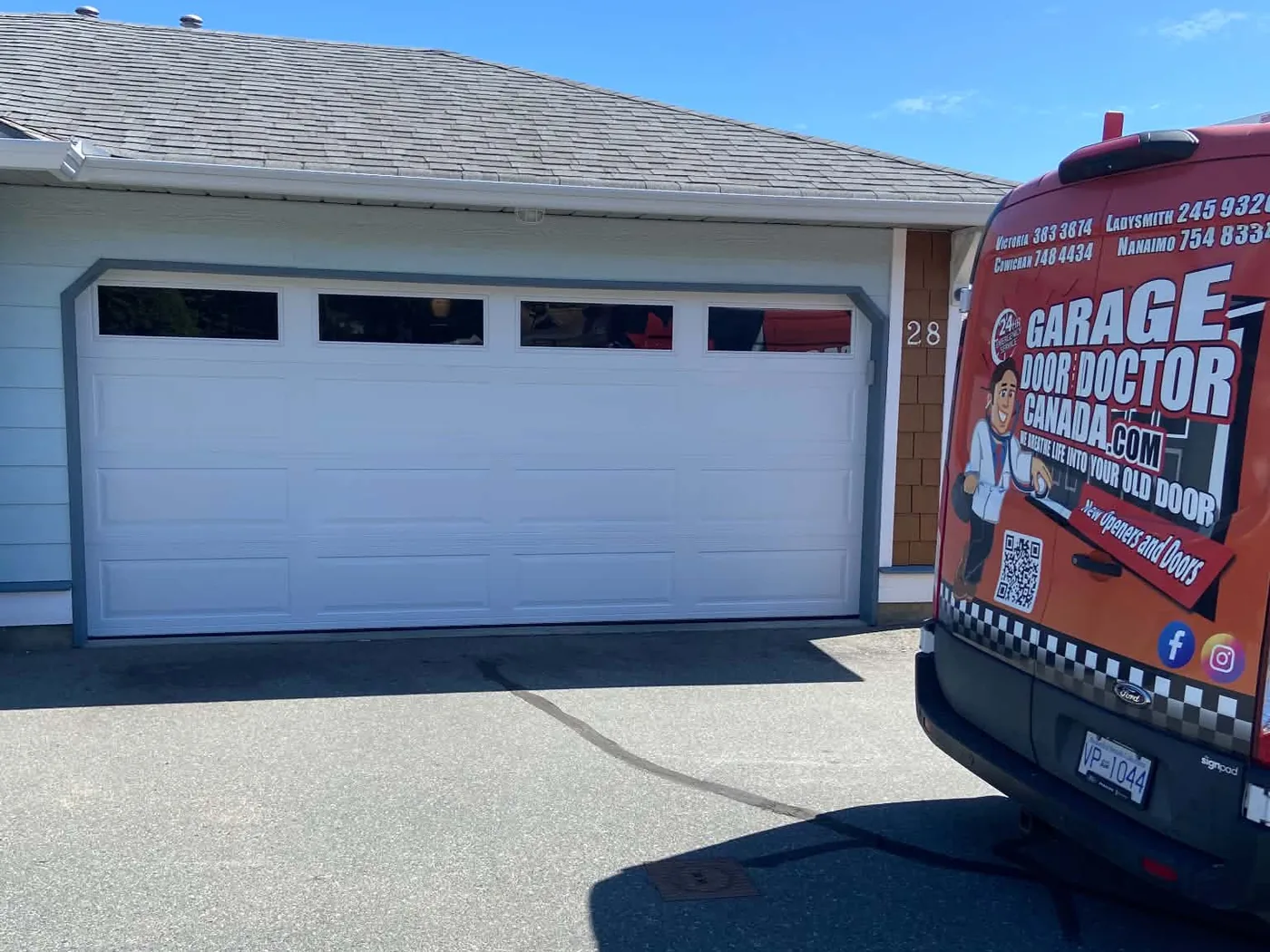 New insulated Hormann Therma Tech 3400 garage door installed at a Station Ridge strata home in Chemainus, with the Garage Door Doctor Canada van in the driveway